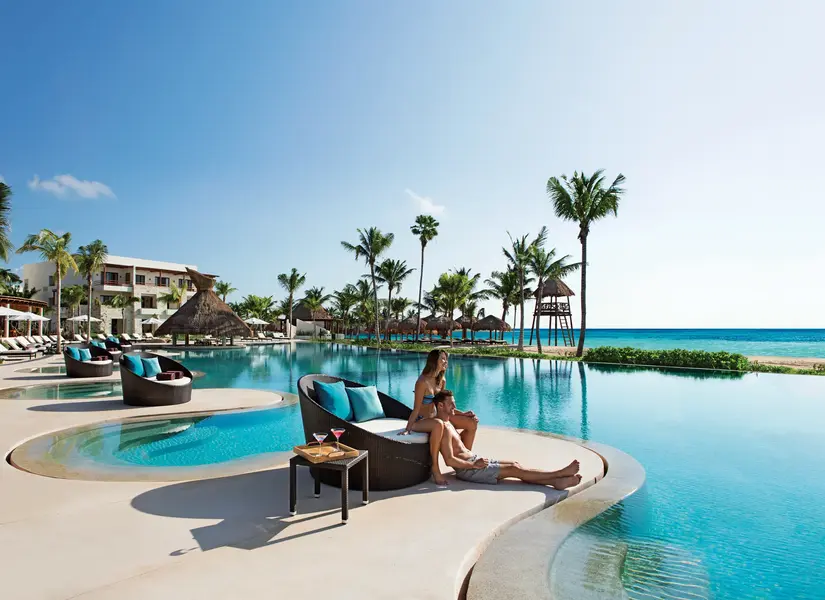 Couple admiring the view from the infinity pool