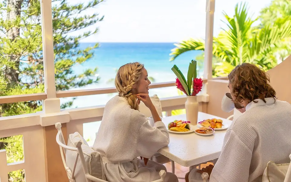 Couple enjoying breakfast on terrace