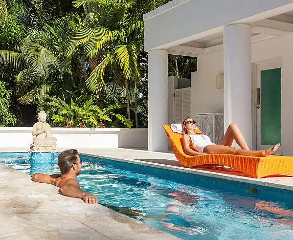 Couple lounging in Buddha pool