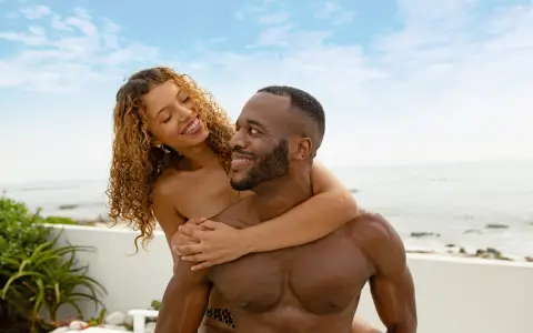 Couple on beach at Grand Lido